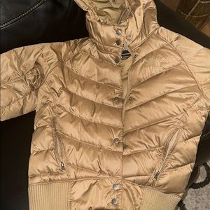 gold slightly cropped north face jacket